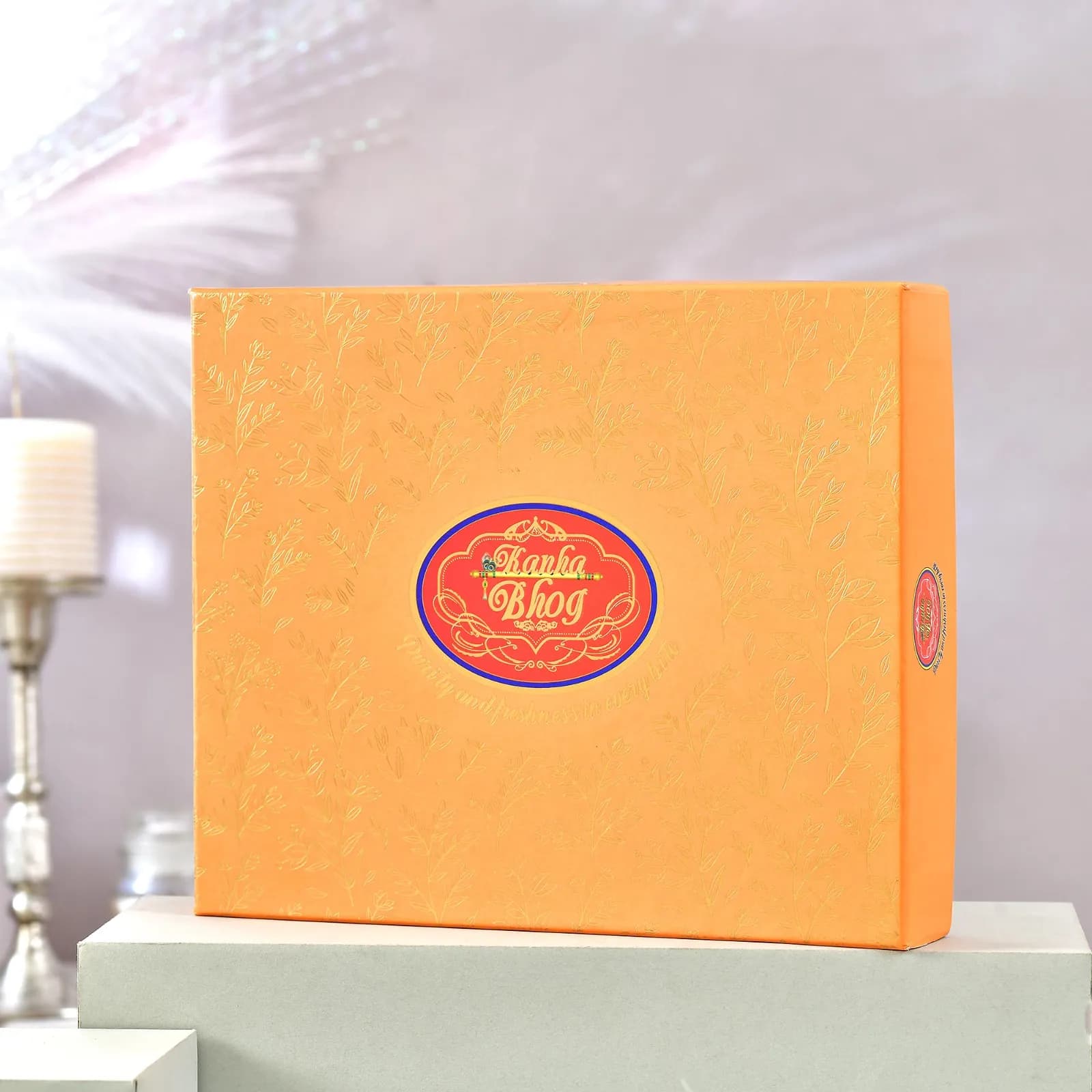 Kanha Bhog gold-embossed floral box, straight view
